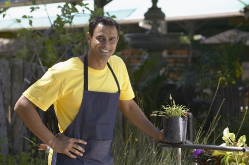 Team member using proper protective equipment during landscaping work